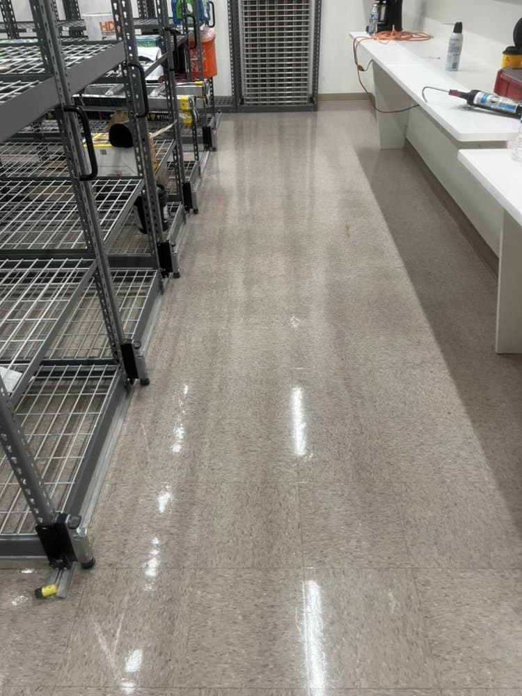 Storeroom with wire racks and tile flooring cleaned and polished